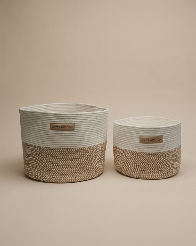 Two Soft Existence woven cotton rope baskets in cream and natural jute, shown side by side
